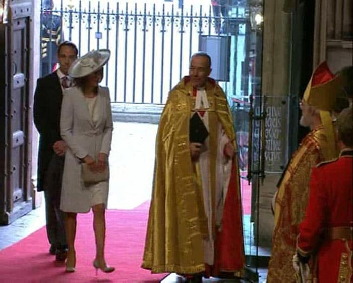 Kate's mother Carole and brother James enter Westminster Abbey.