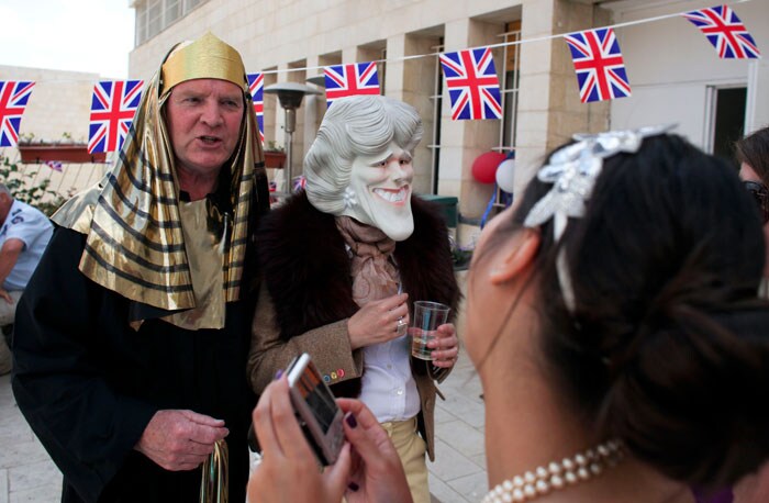 Now, a pharaoh poses with a make-belief Camilla, Duchess of Cornwall, at the costume party.