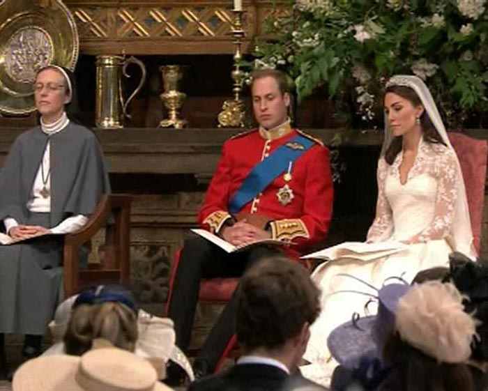 After the exchange of vows, the newlyweds have a sit down while the service proceeds