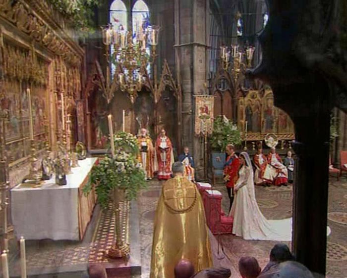 At the altar: The Prince, in the uniform of a Colonel of the Irish Guards, and Kate in her Alexander McQueen dress