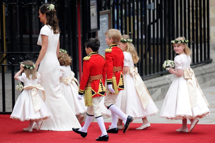 Pippa Middleton, Kate's sister and chief bridesmaid, leads the little ones: Eliza Lopes and Grace van Cutsem, aged 3, Lady Louise Windsor, aged 7, and Margarita Armstrong-Jones, aged 8. The pages follow: William Lowther Pinkerton and Tom Pettifer