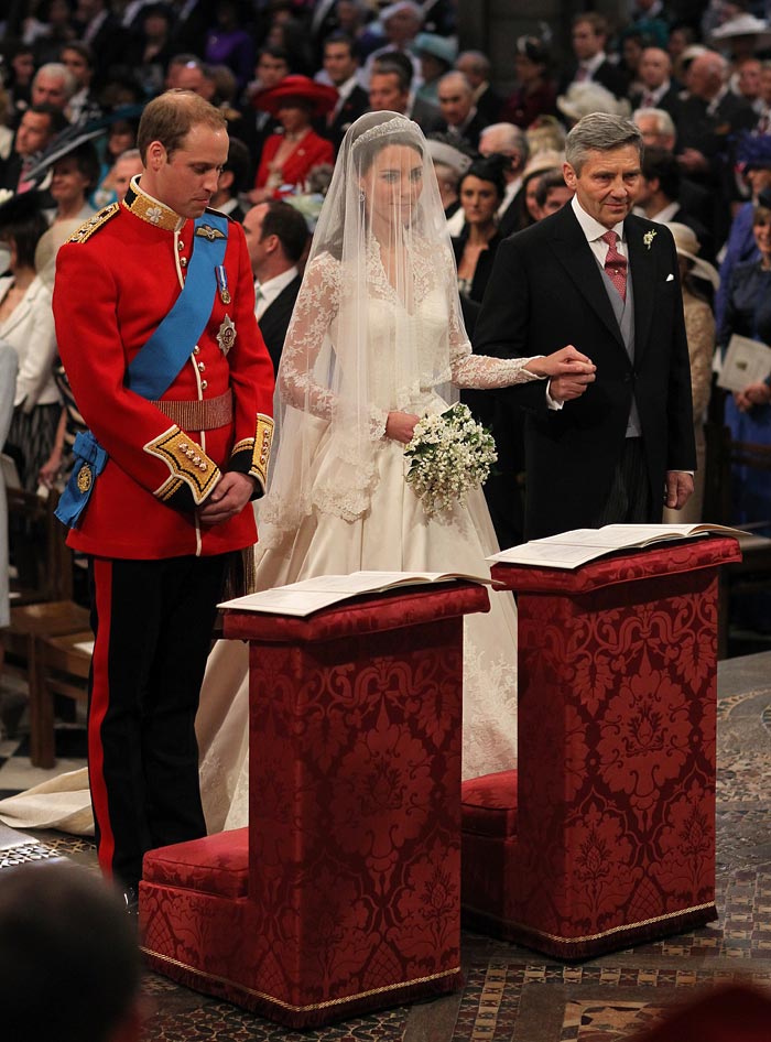 At the altar of Westminster Abbey, just before they exchange vows. Kate is given away by her father, Michael Middleton