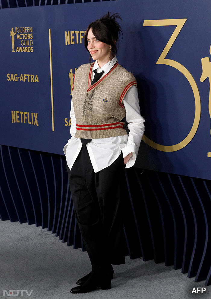 Billie Eilish wore a sweater vest on the red carpet.  (Image Courtesy: AFP)