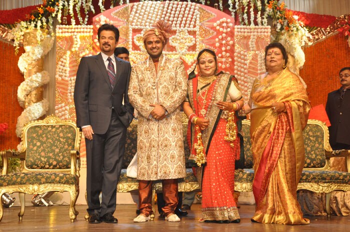 Actor Anil Kapoor poses for the camera with the couple