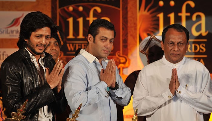 Bollywood actors Salman Khan (C) and Ritesh Deshmukh (L) pose with Sri Lankan Economic development minister Lakshman Yapa Abeywardena (R) during a news conference to promote The International Indian Film Academy (IIFA) awards in Mumbai. Sri Lanka will host top Indian movie stars for the annual "Bollywood Oscars" weekend that showcases one of the world's most ambitious and prolific film industry. The three-day International Indian Film Academy (IIFA) event that runs from June 3-5, will feature performances, premieres, celebrity parties, workshops, business forums, fashion shows and a Twenty20 cricket match. (Photo: AFP)