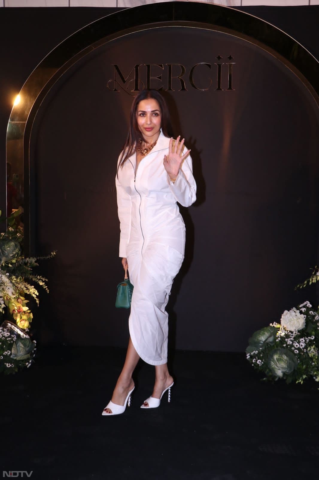 Malaika Arora chose white for the night. (Image Courtesy: Varinder Chawla)