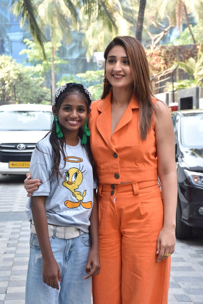 Pop sensation Dhvani Bhanushali was clicked outside the T-series office in Andheri on the occasion of her post-birthday celebrations. Dhvani posed for pictures with Maleesha Kharwa, who is popularly known as "Princess of Slums".