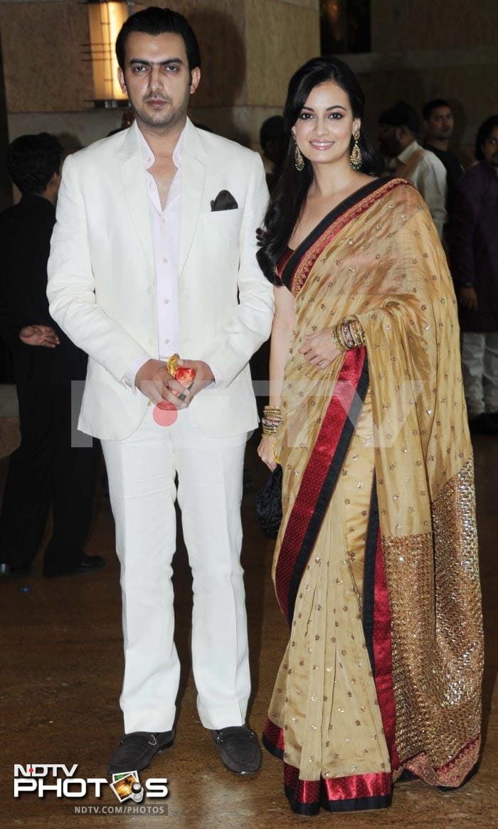 Dia Mirza wore a beige sari with red border. In this picture, she is seen with beau Sahil Sangha.