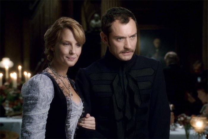 Kelly Reilly as Mary Morstan and Jude Law as Dr. John Watson in the movie <i>Sherlock Holmes</i>. "The reason Sherlock Holmes fails at least as often as it succeeds is because more effort and attention was lavished upon the concept than upon the script. Given a worthy story, Downey's Holmes might have been memorable. Here, he's an interesting character in search of a worthwhile story." - <i>ReelViews</i> (Photo Credit: Warner Bros. Pictures)