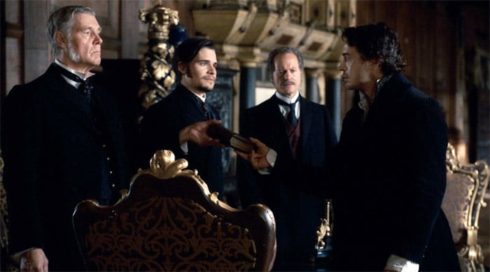 (L-r) James Fox as Sir Thomas Rotheram, Hans Matheson as Lord Coward, William Hope as Ambassador Standish and Robert Downey Jr. as Sherlock Holmes in Warner Bros. Pictures' and Village Roadshow Pictures' action-adventure mystery <i>Sherlock Holmes</i>. "Ritchie is all about the whooshing and headbanging, leaving no space between Holmes' words to savor their meaning. Downey is irresistible. The movie, not so much."  - <i>Rolling Stone</i> (Photo Credit: Warner Bros. Pictures)