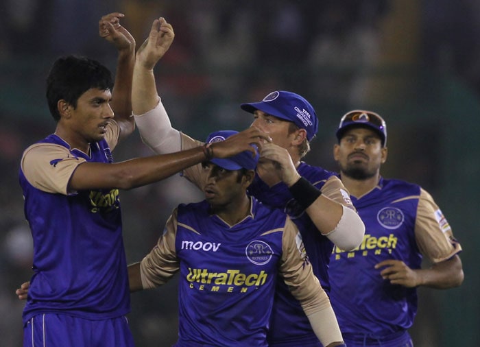 Rajasthan Royals' S K Trivedi (L) being congratulated by teammates for taking a wicket of Kings XI Punjab's batsman Yuvraj Singh during the Indian Premier League 3 match in Mohali. (PTI Photo)