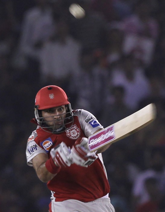 Kings XI Punjab's batsman Yuvraj Singh plays a shot during the Indian Premier League 3 match against Rajasthan Royals in Mohali. (PTI Photo)