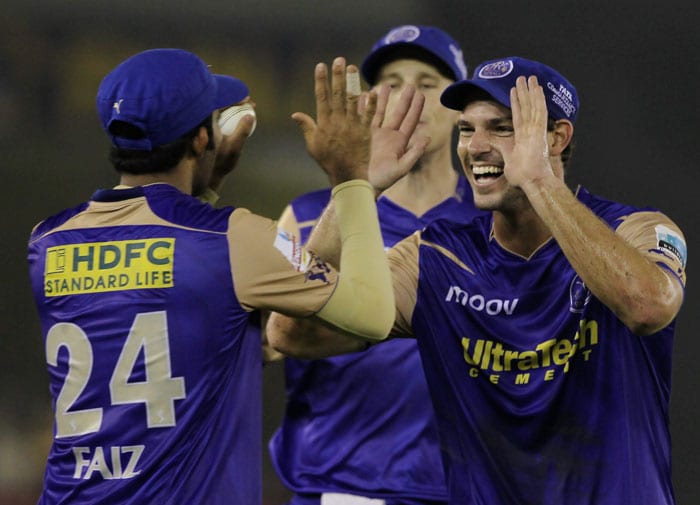 Rajasthan Royals' Michael Lumb (R) celebrates with teammate Faiz Fazal who took the catch of Kings XI Punjab's batsman K Sangakkara during their Indian Premier League 3 match in Mohali. (PTI Photo)