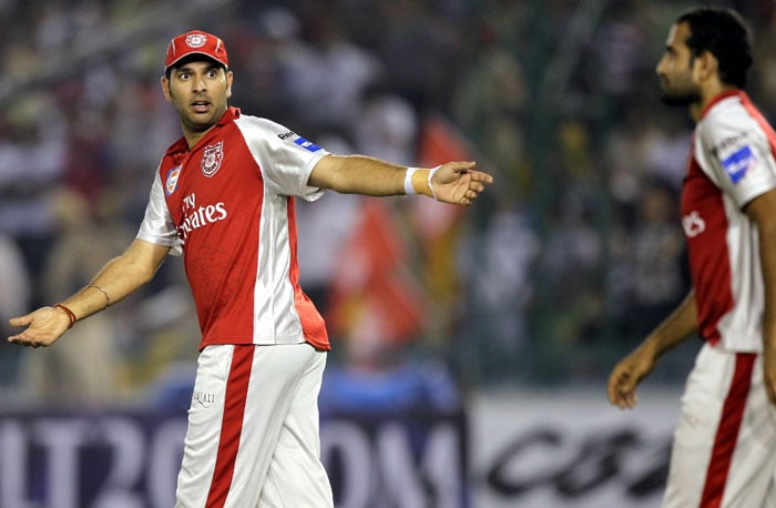 Kings XI Punjab's Yuvraj Singh (L) reacts after teammate Irfan Pathan drops a catch of brother Yusuf Pathan of Rajasthan Royals during the Indian Premier League 3 match in