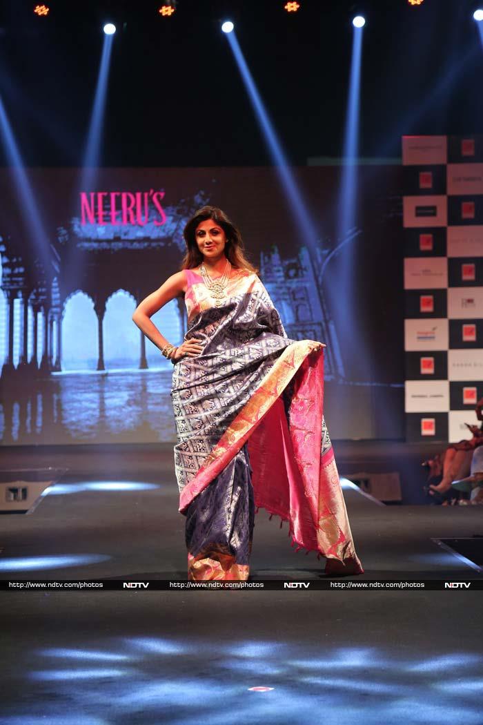 Shilpa Shetty walked the ramp for designer Neeru's new collection om Monday in Mumbai. She looked ravishing in a silk saree and stole the limelight.