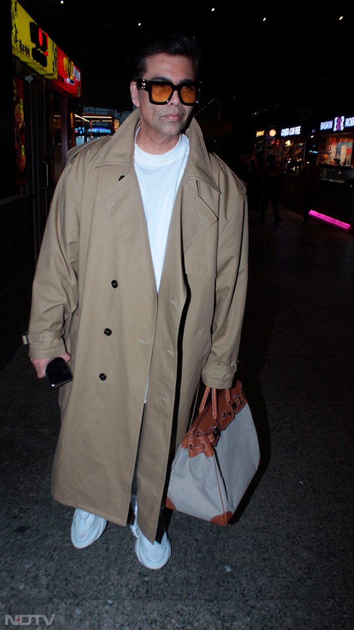 A look at Karan Johar's airport style. (Image courtesy: Varinder Chawla)