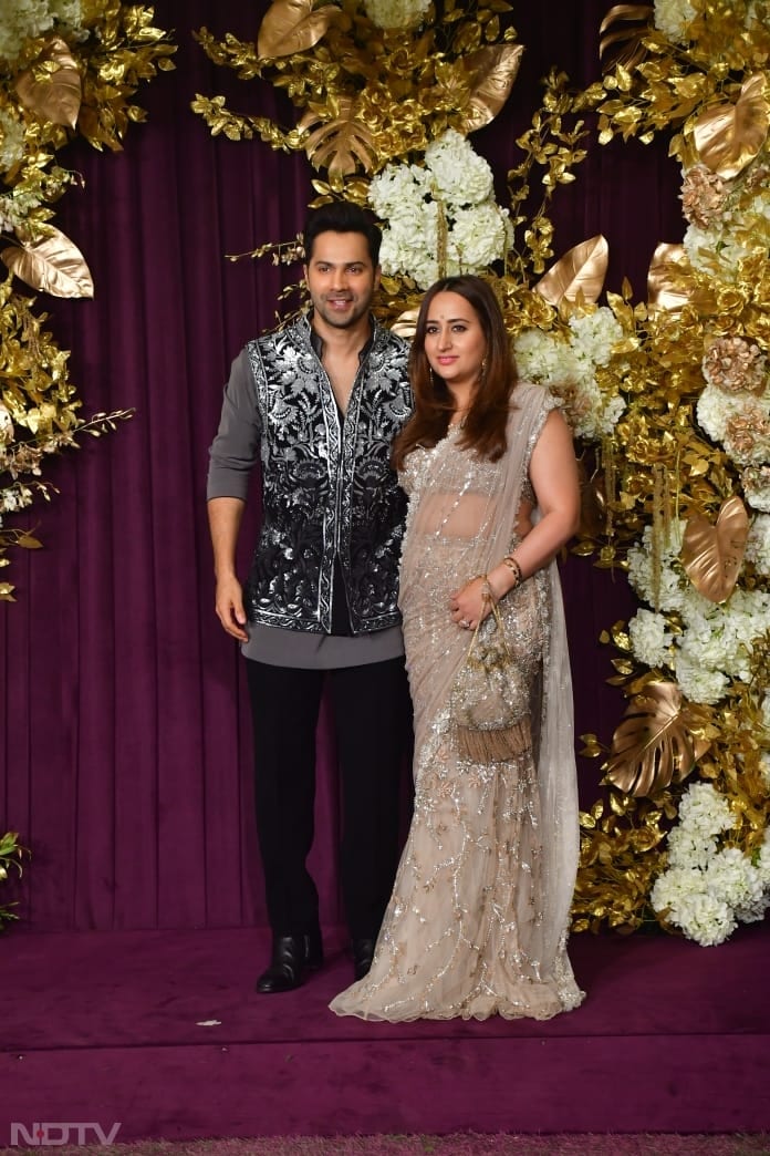 Varun Dhawan and wife Natasha Dalal were all smiles for the shutterbugs stationed there (Image courtesy: Varinder Chawla)