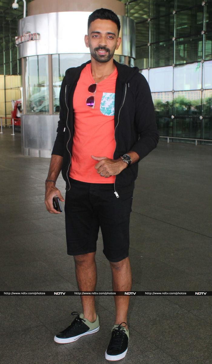 Cricketer Dhawal Kulkarni posed for the shutterbugs at the airport.