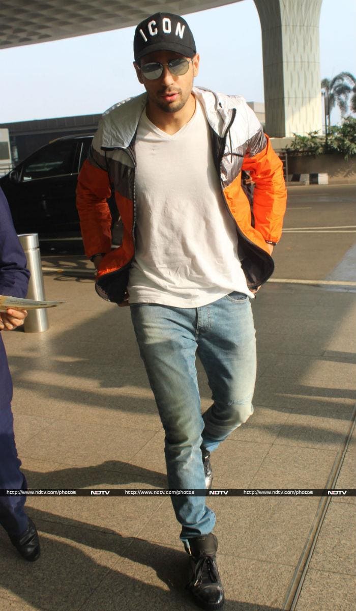 Sidharth looked dapper in a white tee, blue denim and jacket. He aced his look with a cap.