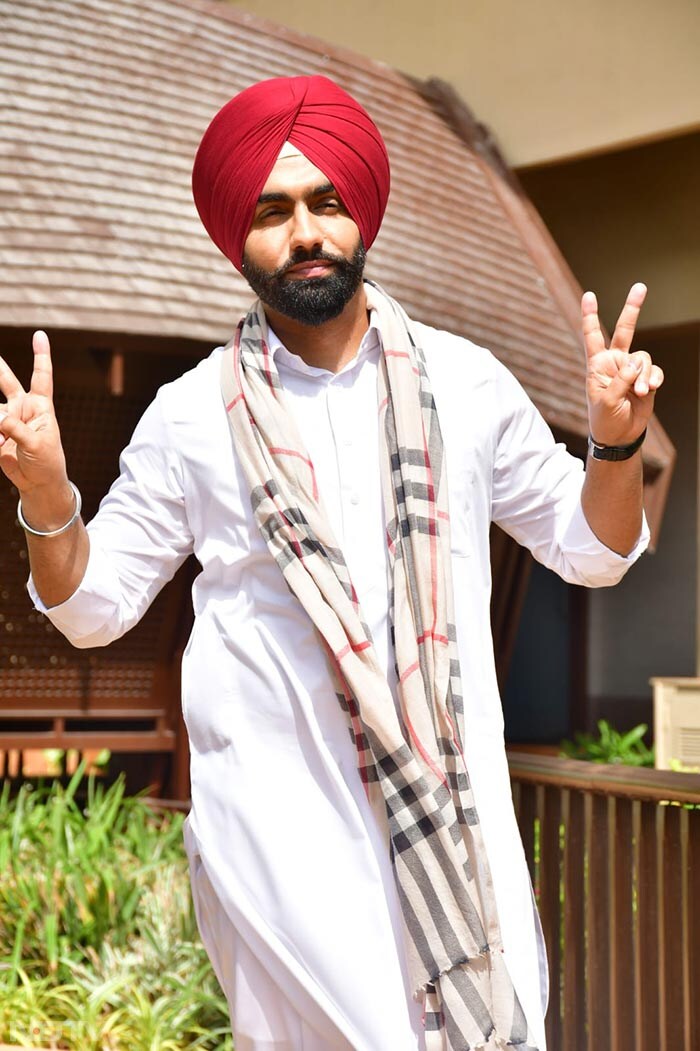 Ammy Virk flashed his widest smile for the paparazzi. (Image Courtesy: Varinder Chawla)