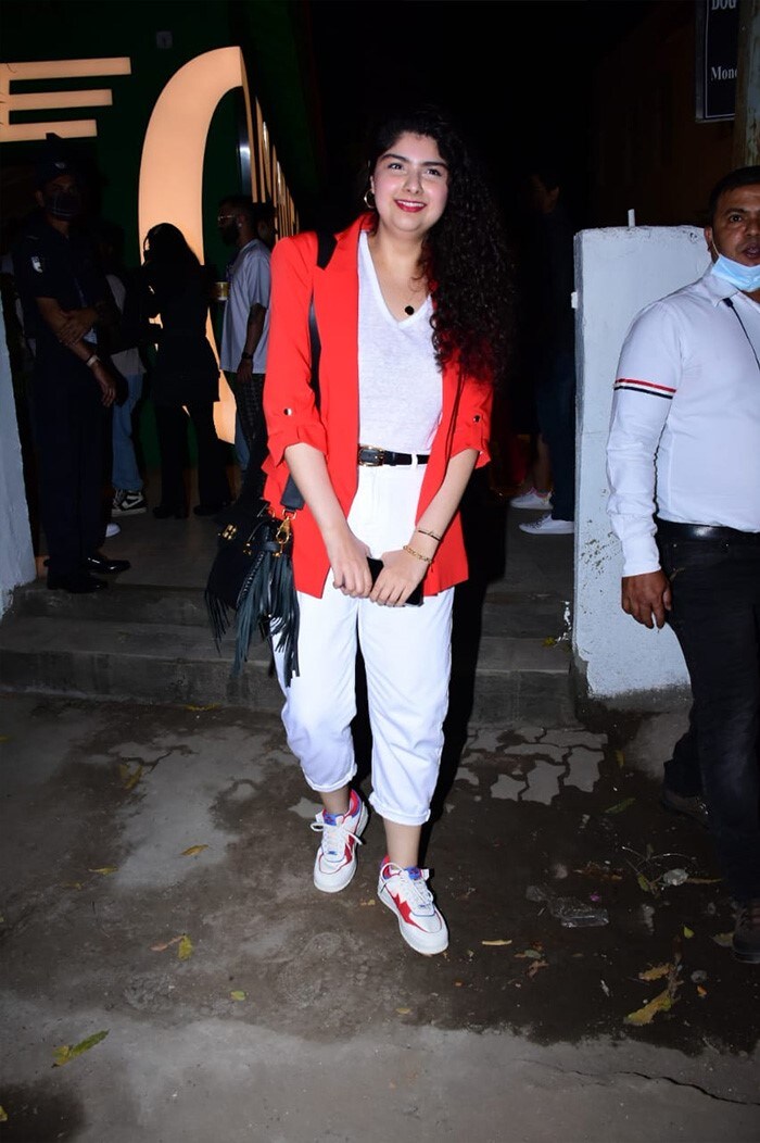 Arjun Kapoor's sister Anshula Kapoor chose a white top and denim with a red blazer look for the 
store launch