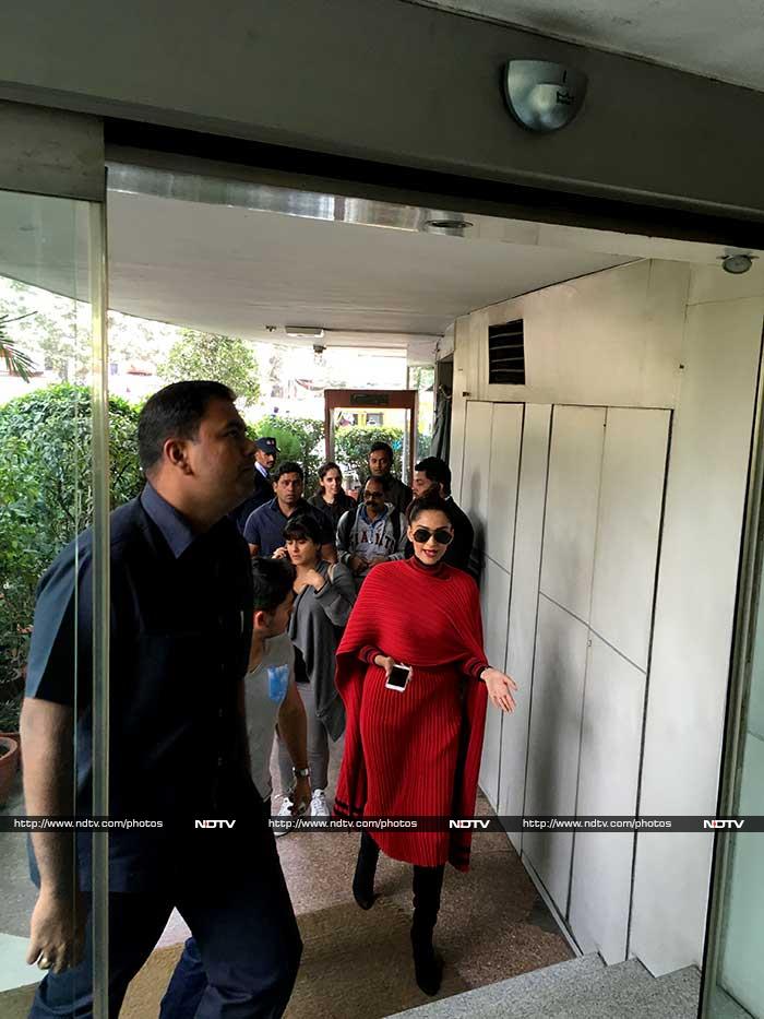 Sonam was stylish in a red, layered Salvatore Ferragamo sweater-dress and black pants. She teamed her outfit with a pair of black boots.  <br><br>Photo courtesy: Chayan Rastogi