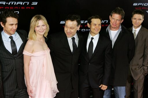 Director Sam Raimi, third from left, and Spider-Man 3 star Tobey Maguire, third from right, smile with co-stars, James Franco, left, Kirsten Dunst, second from left, Thomas Haden Church, second from right, and Topher Grace, upon their arrival at the World Premiere in Tokyo.