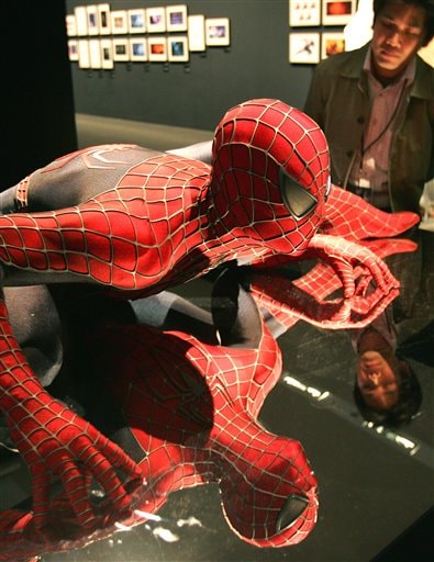 A visitor looks at a figure of Spider-Man at an exhibition prior to the World Premiere of Spider-Man 3 in Tokyo.