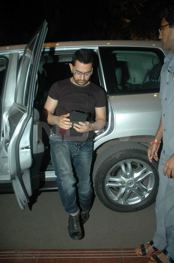 Aamir is hooked on to his new gadget.