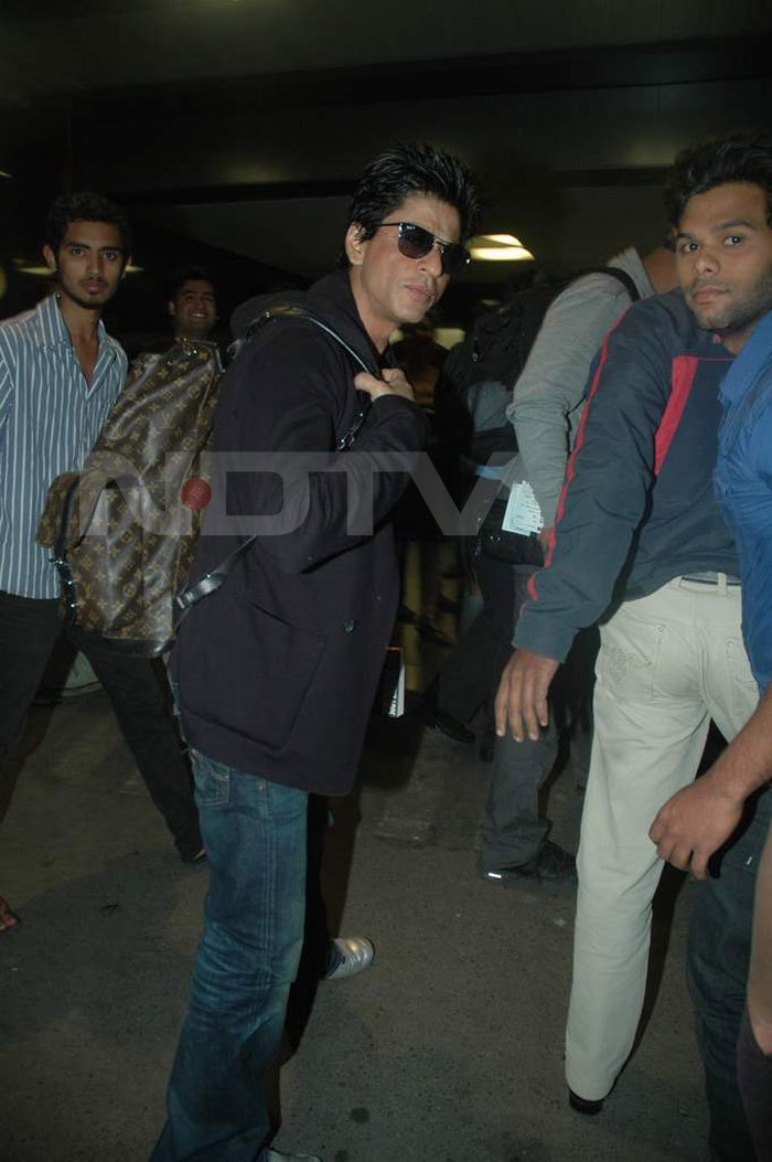 King Khan and his Louis Vuitton backpack are off to South Africa for a concert.