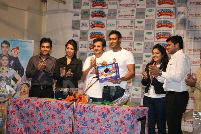 Ajay holds up the audio CD, also seen towards the far left is Krishika Lulla.