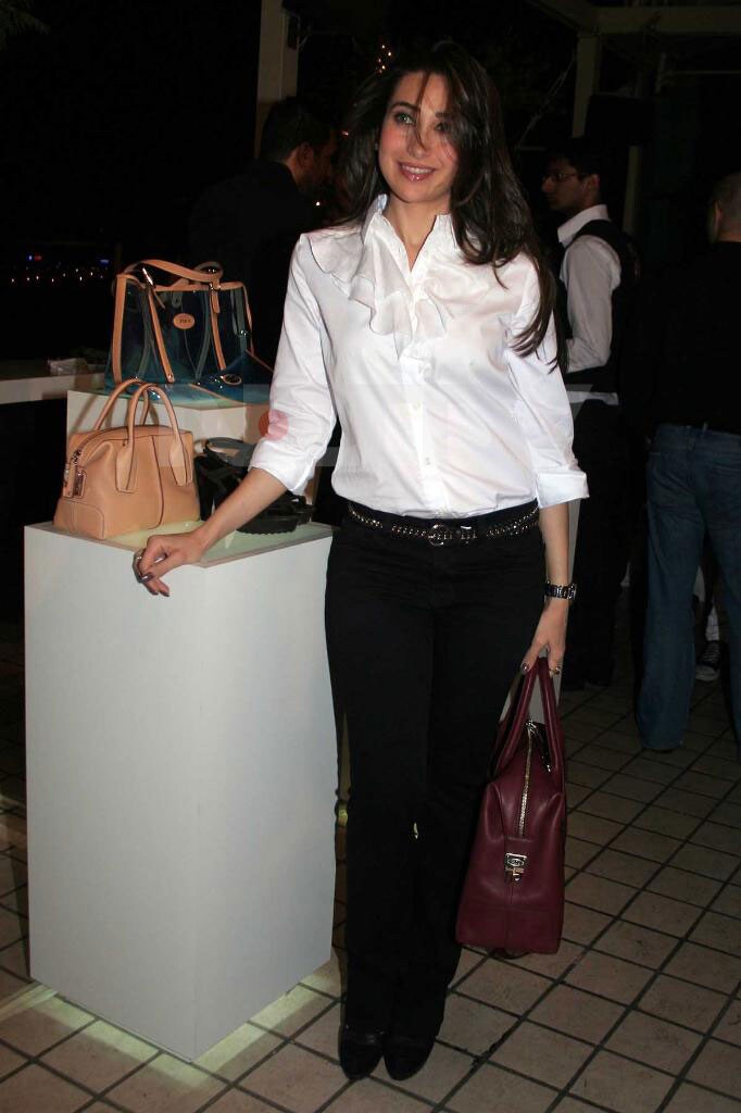 Yummy-licious Karisma Kapoor worked the strict-yet-sexy look with panache at Tod's bag store launch.