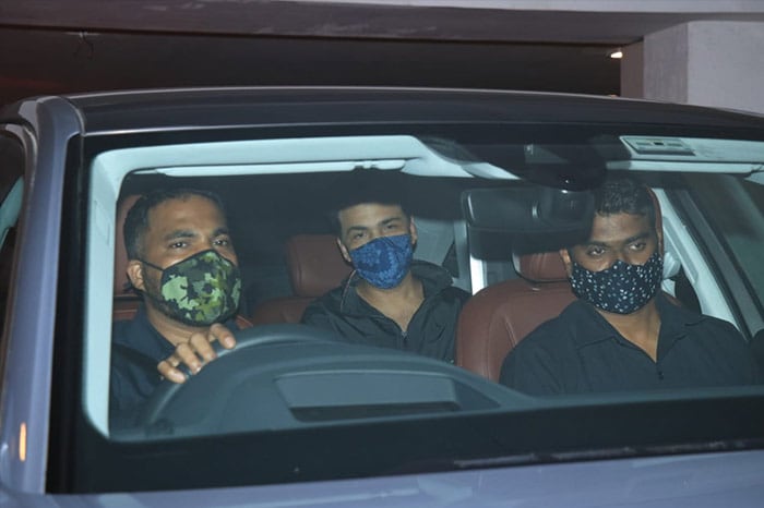 Karan Johar was also photographed sitting in a car outside his residence.