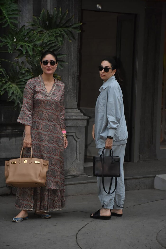 Kareena Kapoor and Karisma Kapoor were spotted outside father Randhir Kapoor's residence in Mumbai.