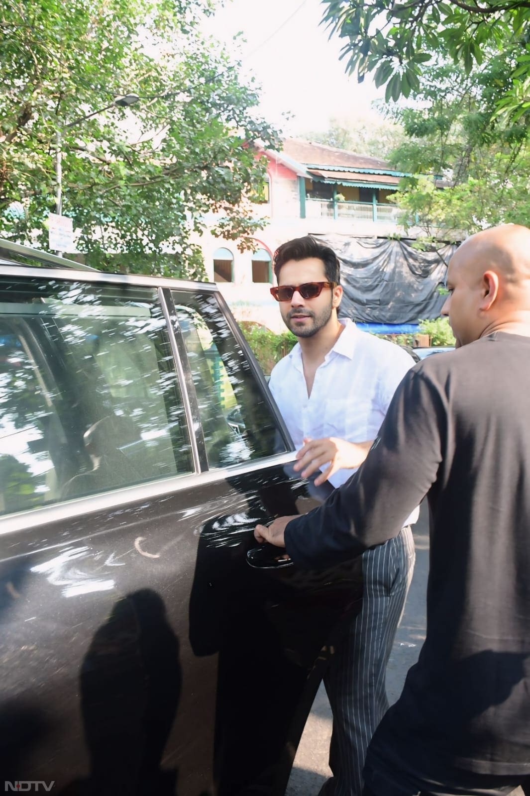 Varun Dhawan looked dapper in a white shirt. (Image Courtesy: Varinder Chawla)