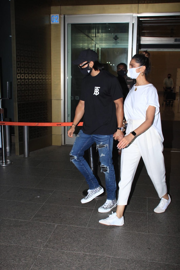 Deepika was dressed in white, husband Ranveer complemented her in a black outfit.