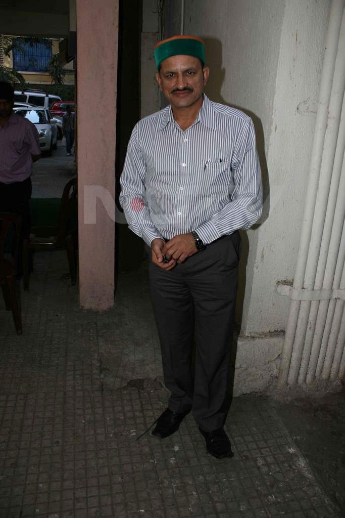 Mir Ranjan Negi stands in a corner.