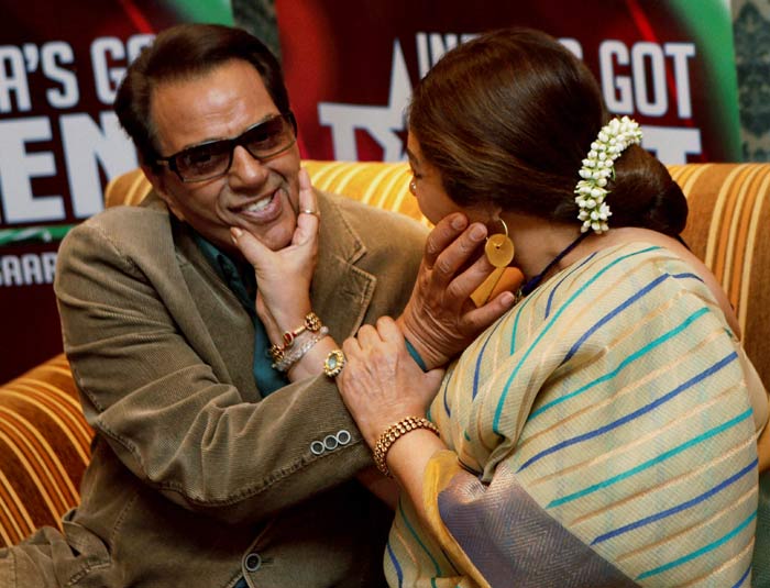 Getting cheeky! Here's a candid moment between Dharmendra and Kirron Kher.