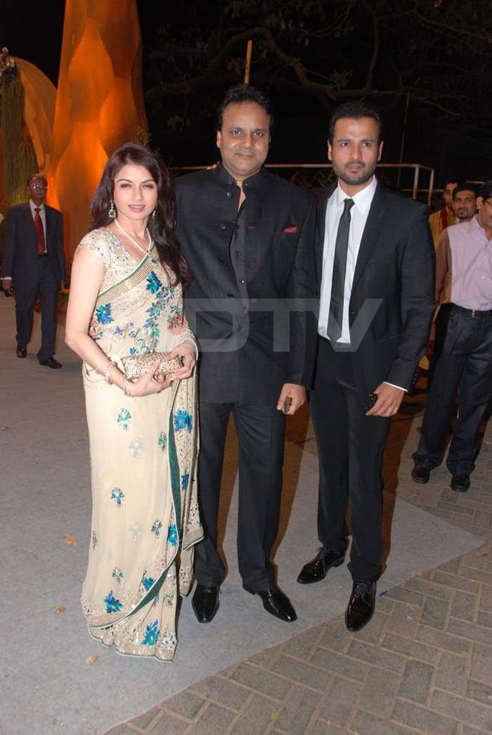 Bhagyashree posed with her husband, Himalaya, and Rohit Roy for the shutterbug.