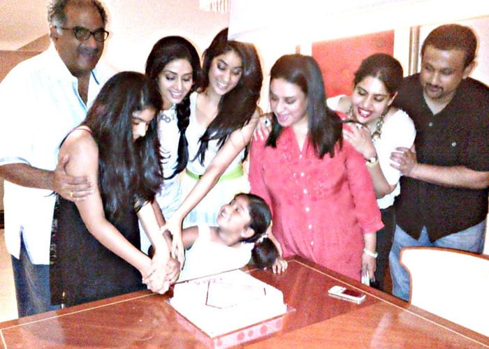 Husband Boney Kapoor, daughters Jhanvi and Khushi and friends help Sridevi cut her birthday cake. <bR><BR>(This picture was posted on Twitter by Sridevi)