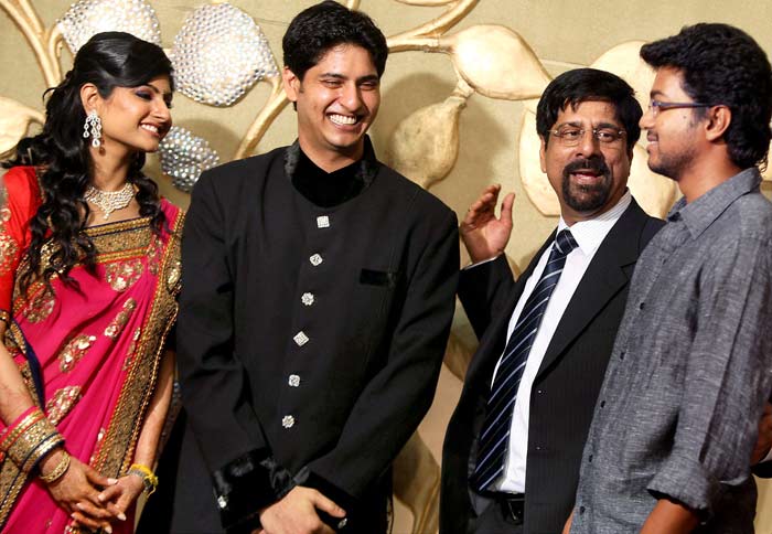 Actor Vijay (R) interacts with former cricketer K Srikkanth?s son Adithya and his newly wedded wife Aishwarya at their wedding reception in Chennai on Wednesday. (Photo: PTI)