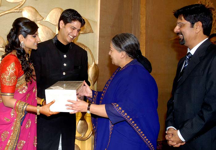 AIADMK Chief J Jayalalitha presents gifts to cricketer Srikanth?s son Adithya and daughter-in-law Aishwarya during their wedding reception, in Chennai. (Photo: PTI)