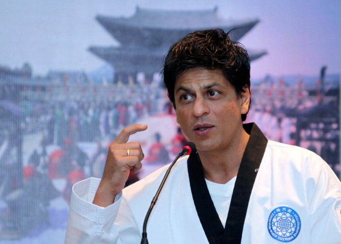 In this picture Shah Rukh gestures in a martial arts uniform after receiving a honorary Taekwondo black belt title in during an event organized by the Korean National Tourism Organization in Mumbai, on Thursday, Oct. 15, 2009. This is Shah Rukh's second international honour this year after he was presented an honorary doctorate in arts and culture by Bedfordshire University in London for his contribution to culture in July. For the doctorate, the 43-year-old was nominated by Routes to Roots, an NGO that works across the SAARC regions to bring South Asian people together. (Photo: AP, Text: Agencies)