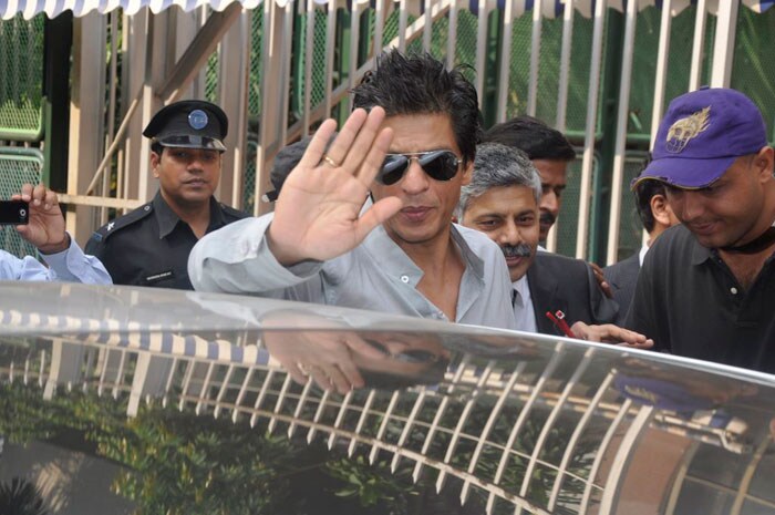 Shah Rukh Khan waves to his fans.