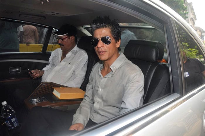 Shah Rukh leaves after the listing ceremony of Eros International Media (EIM) at the Bombay Stock Exchange (BSE) in Mumbai.