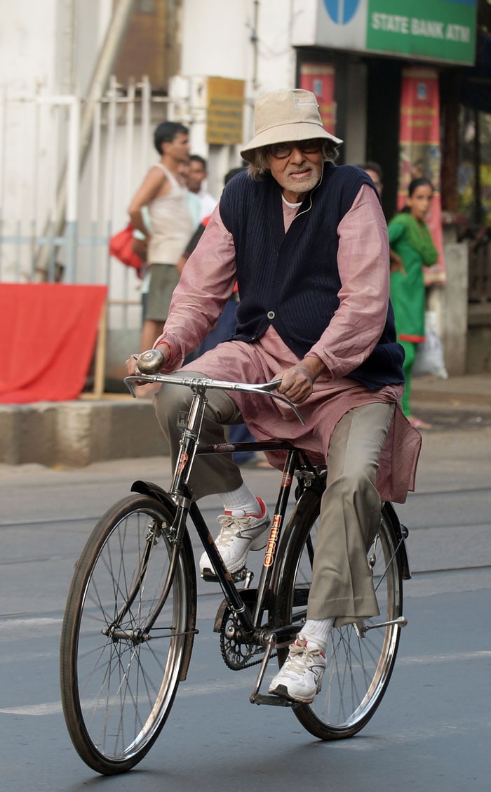 With Song in His Heart, Big B Cycles Through City of Joy