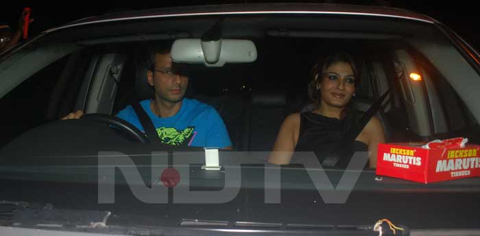 Raveena Tandon and her husband Anil Thadani arrive for the party.