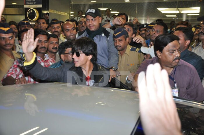 Bollywood superstars Shah Rukh Khan, Kajol and director Karan Johar, who left a trail of fans swooning at the red carpet premiere of <I>My Name is Khan</I> at the Berlin International Film Festival, received a warm welcome on their return to Mumbai.