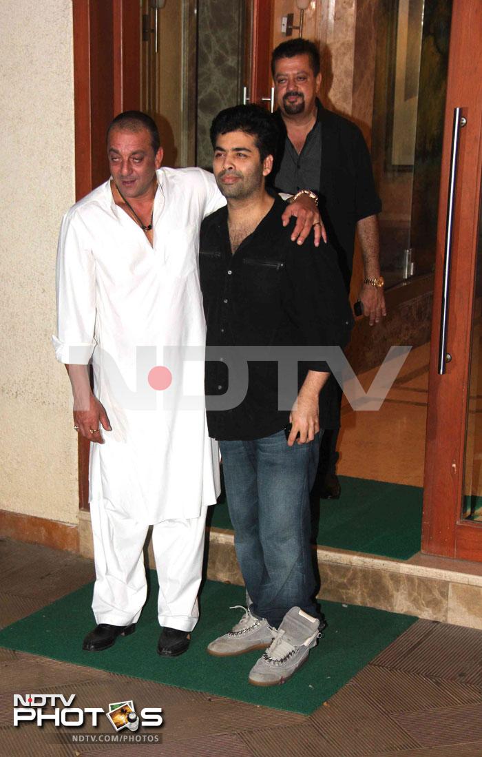 Sanjay Dutt and KJo pose for the shutterbugs.