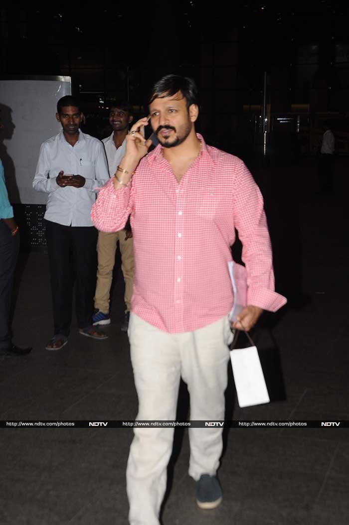 Actor Vivek Oberoi remained busy on his phone.